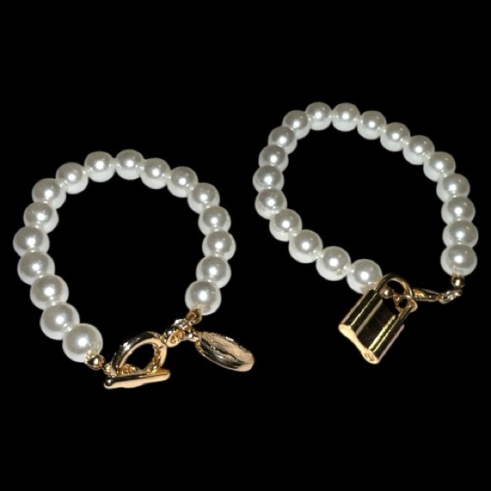 Set of 2 costume faux Gold and White Pearl Bracelets.